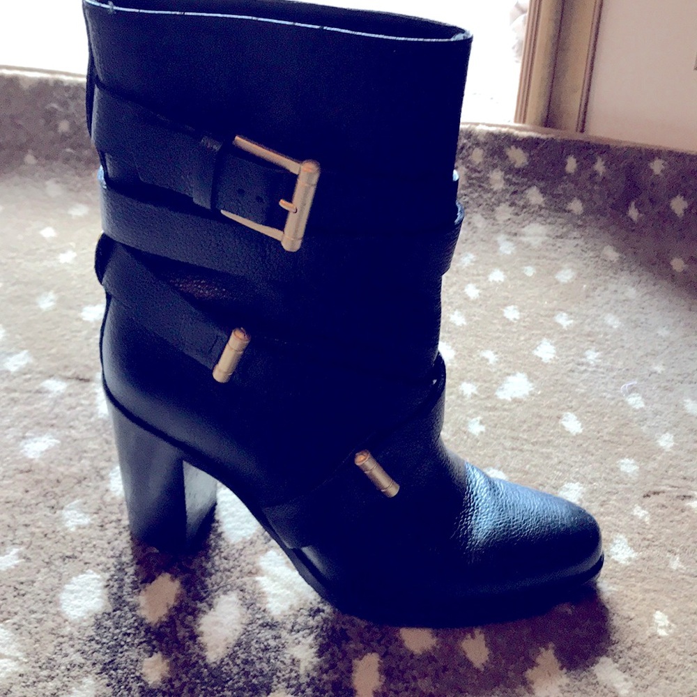 LK Bennett black leather heeled booties with straps. Dress up or down.